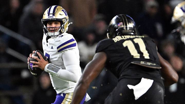 Husky quarterback Elijah Brown looks for an open receiver at Purdue on Friday night. Husky quarterback Elijah Brown looks for an open receiver at Purdue on Friday night.