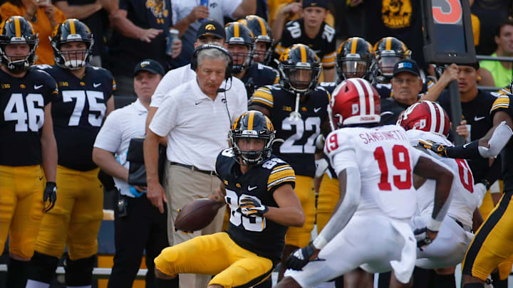 Iowa head football coach keeps an eye on junior receiver Nico Ragaini  s feet as he makes a play for a first down along the sidelines in the third quarter against Indiana at Kinnick Stadium in Iowa City on Saturday, Sept. 4, 2021.

20210904 Iowavsindiana