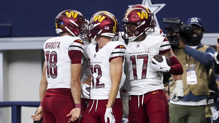 Washington Commanders wide receiver Terry McLaurin celebrates with Luke McCaffrey