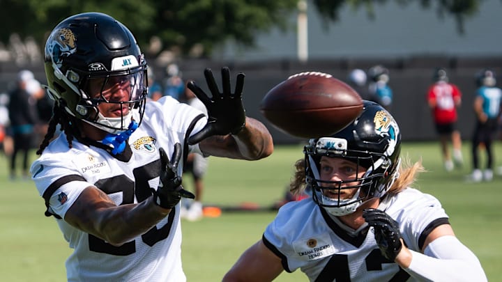 Jacksonville Jaguars safety Antonio Johnson (26) catches a ball during a drill as Jacksonville Jaguars safety Andrew Wingard (42) tries to defend him during the Jacksonville Jaguars’ third mandatory minicamp Thursday June 12, 2025 at the Miller Electric Center in Jacksonville, Fla. [Doug Engle/Florida Times-Union]