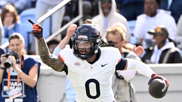 Oct 25, 2025; Chapel Hill, North Carolina, USA; Virginia Cavaliers safety Antonio Clary (0) celebrates after intercepting a pass near the end of the fourth quarter at Kenan Stadium. Mandatory Credit: Bob Donnan-Imagn Images Oct 25, 2025; Chapel Hill, North Carolina, USA; Virginia Cavaliers safety Antonio Clary (0) celebrates after intercepting a pass near the end of the fourth quarter at Kenan Stadium. Mandatory Credit: Bob Donnan-Imagn Images