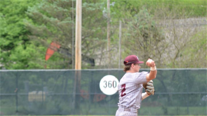John Glenn shortstop Colt Emerson throws to first base Monday's 3-1 loss to West Holmes.