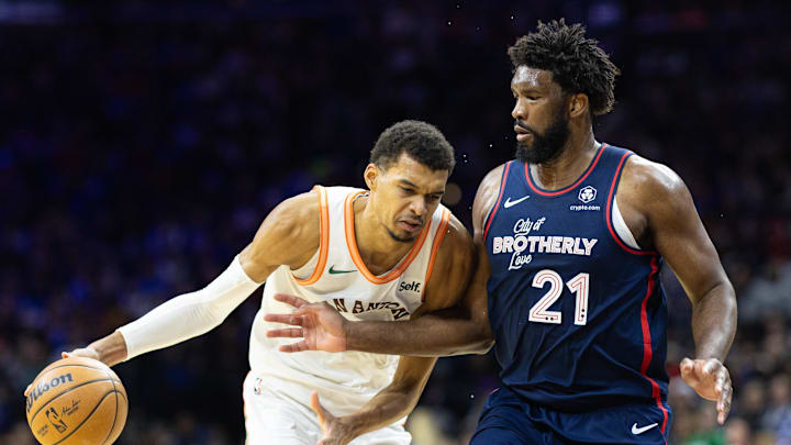 Jan 22, 2024; Philadelphia, Pennsylvania, USA; San Antonio Spurs center Victor Wembanyama (1) dribbles the ball against Philadelphia 76ers center Joel Embiid (21) during the third quarter at Wells Fargo Center. Mandatory Credit: Bill Streicher-Imagn Images Jan 22, 2024; Philadelphia, Pennsylvania, USA; San Antonio Spurs center Victor Wembanyama (1) dribbles the ball against Philadelphia 76ers center Joel Embiid (21) during the third quarter at Wells Fargo Center. Mandatory Credit: Bill Streicher-Imagn Images