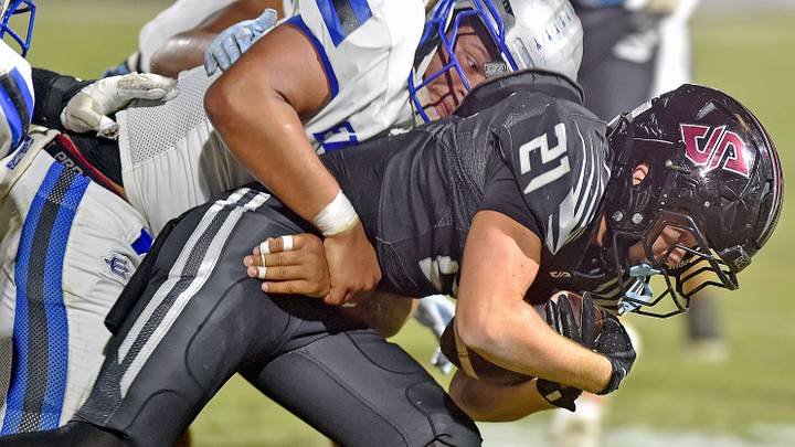 Southside's Miles Rickles tries to evade the tackle of Etowah's Julian Douglas during high school football action in Southside, Ala., on September25, 2026. Southside's Miles Rickles tries to evade the tackle of Etowah's Julian Douglas during high school football action in Southside, Ala., on September25, 2026.