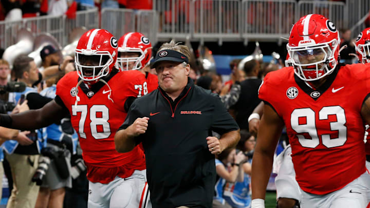 Georgia coach Kirby Smart leads his team onto the field before the start of the NCAA Aflac Kickoff Game in Atlanta, on Saturday, Aug. 31, 2024.