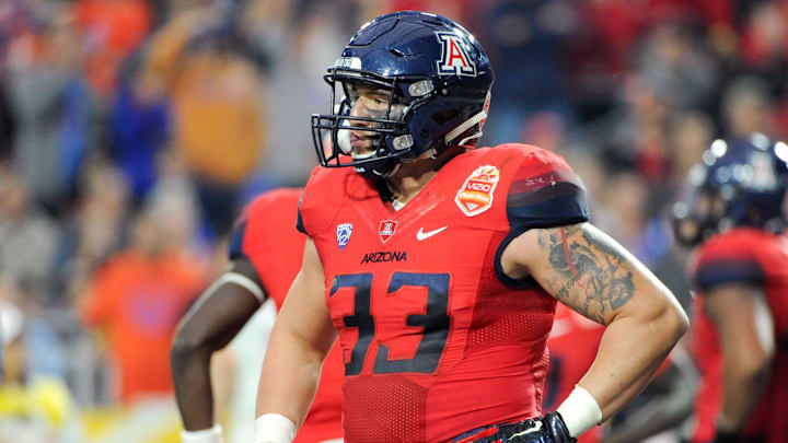 Dec 31, 2014; Glendale, AZ, USA; Arizona Wildcats linebacker Scooby Wright III (33) stands on the field during the second quarter against the Boise State Broncos in the 2014 Fiesta Bowl at Phoenix Stadium. The Broncos won 38-30. Mandatory Credit: Casey Sapio-Imagn Images