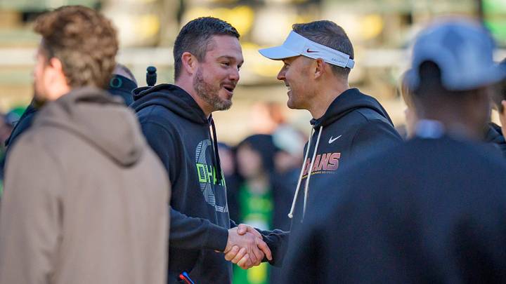 Oregon head coach Dan Lanning, left, and USC head coach Lincoln Riley shake hands before the game as the Oregon Ducks host the USC Trojans on Nov. 22, 2025, at Autzen Stadium in Eugene, Oregon. Oregon head coach Dan Lanning, left, and USC head coach Lincoln Riley shake hands before the game as the Oregon Ducks host the USC Trojans on Nov. 22, 2025, at Autzen Stadium in Eugene, Oregon.