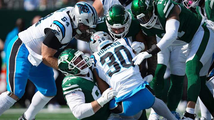Carolina Panthers running back Chuba Hubbard (30) is tackled by the New York Jets defensive line during a game at MetLife Stadium, Oct 19, 2025, East Rutherford, NJ, USA.