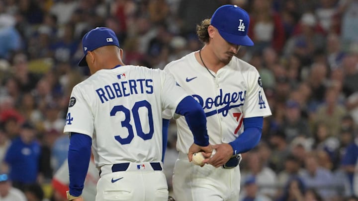 Sep 16, 2025; Los Angeles, California, USA; Los Angeles Dodgers manager Dave Roberts (30) pulls relief pitcher Justin Wrobleski (70) during the sixth inning against the Philadelphia Phillies at Dodger Stadium. Mandatory Credit: Jayne Kamin-Oncea-Imagn Images