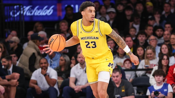 Oct 25, 2025; New York, NY, USA; Michigan Wolverines forward Yaxel Lendeborg (23) looks for an open teammate in the second half against the St. John's Red Storm at Madison Square Garden. Oct 25, 2025; New York, NY, USA; Michigan Wolverines forward Yaxel Lendeborg (23) looks for an open teammate in the second half against the St. John's Red Storm at Madison Square Garden.