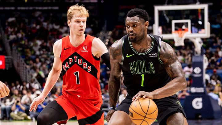 Mar 11, 2026; New Orleans, Louisiana, USA;  New Orleans Pelicans forward Zion Williamson (1) dribbles against Toronto Raptors guard/forward Gradey Dick (1) during the first half at Smoothie King Center. Mandatory Credit: Stephen Lew-Imagn Images