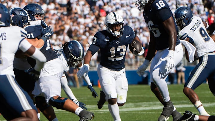 Penn State running back Kaytron Allen rushes for a 12-yard touchdown in the first half of an NCAA football game against Nevada.