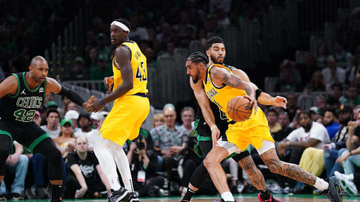 May 23, 2024; Boston, Massachusetts, USA; Indiana Pacers forward Obi Toppin (1) dribbles the ball past Boston Celtics forward Jayson Tatum (0) in the first half during game two of the eastern conference finals for the 2024 NBA playoffs at TD Garden. Mandatory Credit: David Butler II-USA TODAY Sports