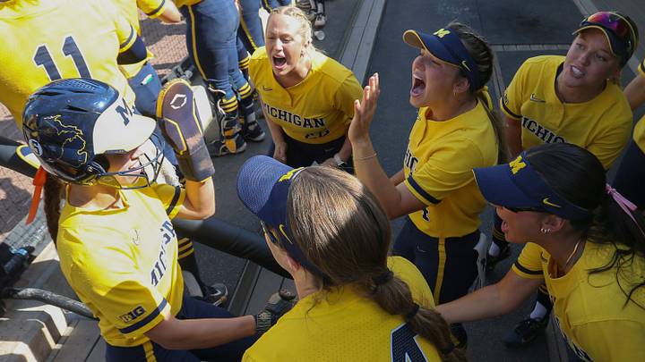 Michigan Wolverines utility Indiana Langford (44) celebrates with teammates after scoring Saturday, May 10, 2025, during the Big Ten softball tournament championship game against the UCLA Bruins at Purdue University’s Bittinger Stadium in West Lafayette, Indiana. Michigan Wolverines won 2-0. Michigan Wolverines utility Indiana Langford (44) celebrates with teammates after scoring Saturday, May 10, 2025, during the Big Ten softball tournament championship game against the UCLA Bruins at Purdue University’s Bittinger Stadium in West Lafayette, Indiana. Michigan Wolverines won 2-0.