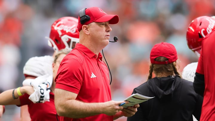 Nov 18, 2023; Miami Gardens, Florida, USA; Louisville Cardinals head coach Jeff Brohm looks on from