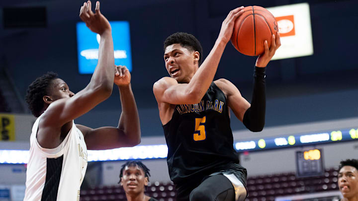 Lincoln Park's Meleek Thomas darts through the air after Euro stepping into the paint during the PIAA Class 4A Boys' Basketball Championship against Neumann-Goretti at the Giant Center on March 23, 2023, in Hershey. The Leopards won, 62-58, to claim their third title in nine seasons.