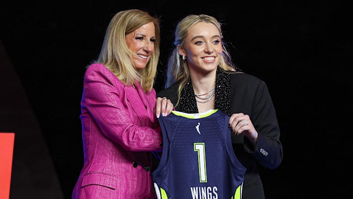 Paige Bueckers poses with WNBA commissioner Cathy Engelbert after being selected with the number one overall pick to the Dallas Wings in the 2025 WNBA Draft.