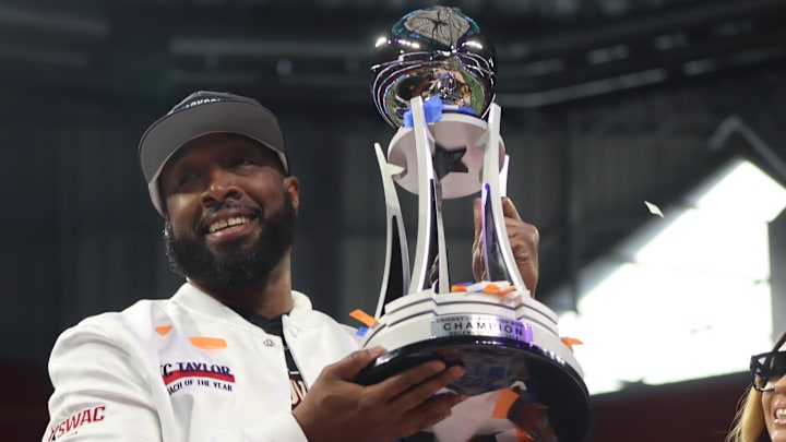 Jackson State Head Coach TC Taylor hoists the 2024 Cricket Celebration Bowl Trophy as the Tigers defeated South Carolina State 28-7 at Mercedes-Benz Stadium.  December 14, 2024; Credit: Kyle T. Mosley, HBCU Legends