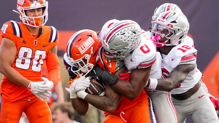 Ohio State Buckeyes linebacker Sonny Styles (0) tackles Illinois Fighting Illini tight end Jordan Anderson (23) during the second half of the NCAA football game at Gies Memorial Stadium in Champaign on Oct. 11, 2025. Ohio State won 34-16.