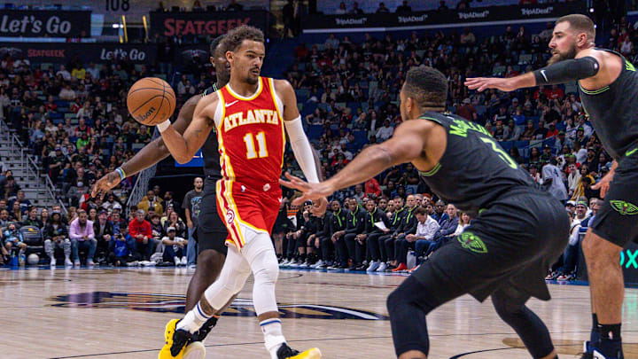 Nov 4, 2023; New Orleans, Louisiana, USA;  Atlanta Hawks guard Trae Young (11) passes the ball against New Orleans Pelicans guard CJ McCollum (3) during the first half at Smoothie King Center. Mandatory Credit: Stephen Lew-Imagn Images