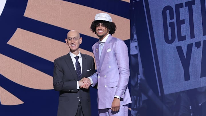 Jun 25, 2025; Brooklyn, NY, USA; Asa Newell stands with NBA commissioner Adam Silver after being selected as the 23rd pick by the New Orleans Pelicans in the first round of the 2025 NBA Draft at Barclays Center. Mandatory Credit: Brad Penner-Imagn Images Jun 25, 2025; Brooklyn, NY, USA; Asa Newell stands with NBA commissioner Adam Silver after being selected as the 23rd pick by the New Orleans Pelicans in the first round of the 2025 NBA Draft at Barclays Center. Mandatory Credit: Brad Penner-Imagn Images