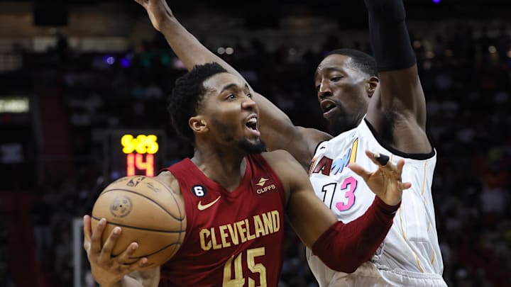 Mar 8, 2023; Miami, Florida, USA; Cleveland Cavaliers guard Donovan Mitchell (45) drives to the basket against Miami Heat center Bam Adebayo (13) during the third quarter at Miami-Dade Arena. Mandatory Credit: Sam Navarro-USA TODAY Sports Mar 8, 2023; Miami, Florida, USA; Cleveland Cavaliers guard Donovan Mitchell (45) drives to the basket against Miami Heat center Bam Adebayo (13) during the third quarter at Miami-Dade Arena. Mandatory Credit: Sam Navarro-USA TODAY Sports