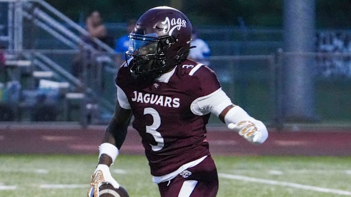 Appoquinimink's Jahsiear Rogers takes the opening kickoff for a touchdown but the return is nullified by a penalty in the Jaguars' 34-20 win against Dover at Appoquinimink, Sept 5, 2025.
