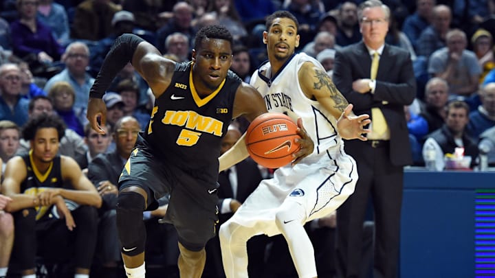 Feb 17, 2016; University Park, PA, USA; Iowa Hawkeyes guard Anthony Clemmons (5) drives to the basket past Penn State Nittany Lions guard Isaiah Washington (21) during the second half at the Bryce Jordan Center.  The Nittany Lions won 79-75.  Mandatory Credit: Rich Barnes-Imagn Images