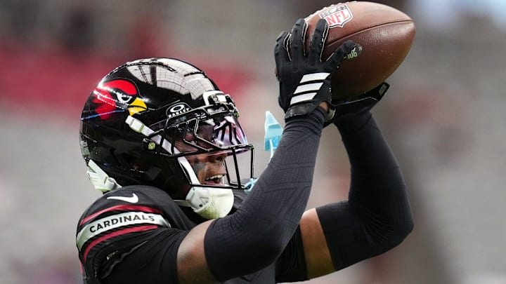 Arizona Cardinals cornerback Will Johnson (0) catches a pass during warmups before their game against the Tennessee Titans at State Farm Stadium in Glendale on Oct. 5, 2025.