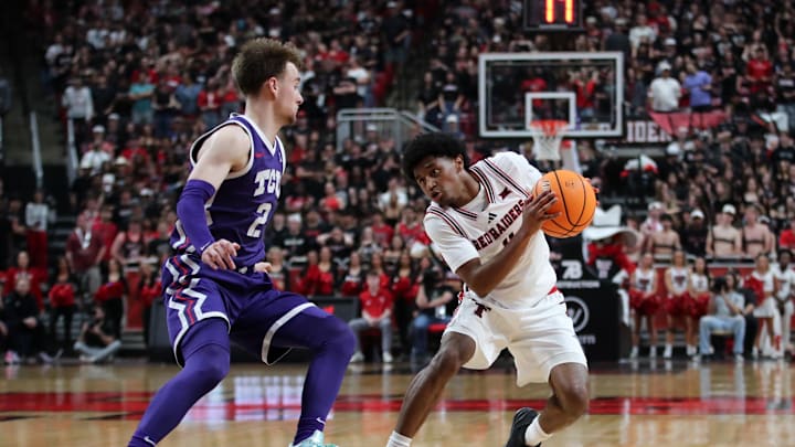 Mar 3, 2026; Lubbock, Texas, USA; Texas Tech Red Raiders guard Jaylen Petty (11) keeps the ball from TCU Horned Frogs guard Brock Harding (2) in the second half at United Supermarkets Arena. Mandatory Credit: Michael C. Johnson-Imagn Images