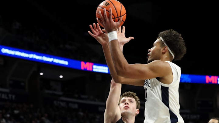 Dec 29, 2024; University Park, Pennsylvania, USA; Penn State Nittany Lions guard/forward Puff Johnson (5) drives the ball to the basket during the first half against the Penn Quakers at Bryce Jordan Center. Penn State defeated Penn 86-66. Mandatory Credit: Matthew O'Haren-Imagn Images