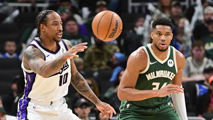 Nov 1, 2025; Milwaukee, Wisconsin, USA; Sacramento Kings forward DeMar DeRozan (10) passes the ball against Milwaukee Bucks forward Giannis Antetokounmpo (34) in the first quarter at Fiserv Forum. Mandatory Credit: Benny Sieu-Imagn Images