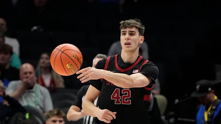 Mar 13, 2025; Charlotte, NC, USA; Stanford Cardinal forward Maxime Raynaud (42) passes the ball in the first half at Spectrum Center. Mandatory Credit: Bob Donnan-Imagn Images Mar 13, 2025; Charlotte, NC, USA; Stanford Cardinal forward Maxime Raynaud (42) passes the ball in the first half at Spectrum Center. Mandatory Credit: Bob Donnan-Imagn Images