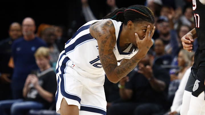 Nov 25, 2024; Memphis, Tennessee, USA; Memphis Grizzlies guard Ja Morant (12) reacts after a three point basket during the first half against the Portland Trail Blazers at FedExForum. Mandatory Credit: Petre Thomas-Imagn Images
