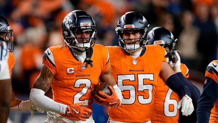 Dec 15, 2024; Denver, Colorado, USA; Denver Broncos cornerback Pat Surtain II (2) reacts with linebacker Cody Barton (55) after an interception in the fourth quarter against the Indianapolis Colts at Empower Field at Mile High Dec 15, 2024; Denver, Colorado, USA; Denver Broncos cornerback Pat Surtain II (2) reacts with linebacker Cody Barton (55) after an interception in the fourth quarter against the Indianapolis Colts at Empower Field at Mile High