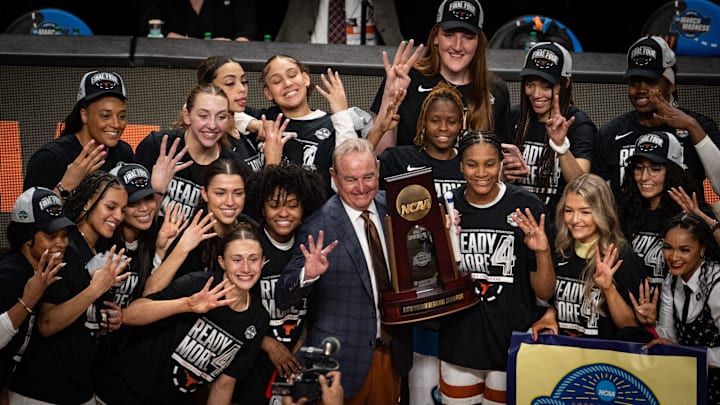 Texas Longhorns head coach Vic Schaefer and his team celebrate after the Longhorns' 58-47 win over the TCU Horned Frogs in the NCAA Playoff Regional final game against at Legacy Arena in Birmingham Alabama, March 31, 2025. The Longhorns will face South Carolina in the Final Four.