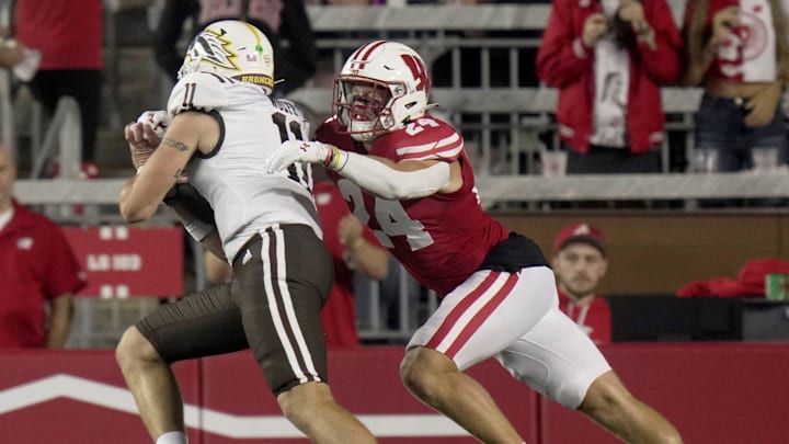 Wisconsin safety Hunter Wohler (24) stops Western Michigan quarterback Hayden Wolff (11) short of a touchdown during the second quarter of their game Friday, August 30, 2024 at Camp Randall Stadium in Madison, Wisconsin. Wisconsin safety Hunter Wohler (24) stops Western Michigan quarterback Hayden Wolff (11) short of a touchdown during the second quarter of their game Friday, August 30, 2024 at Camp Randall Stadium in Madison, Wisconsin.