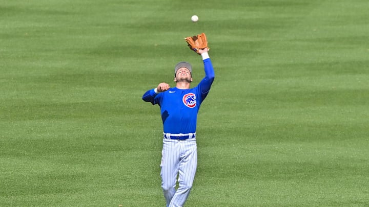Mar 2, 2023; Mesa, Arizona, USA; Chicago Cubs shortstop Nico Hoerner (2) catches a fly ball in the