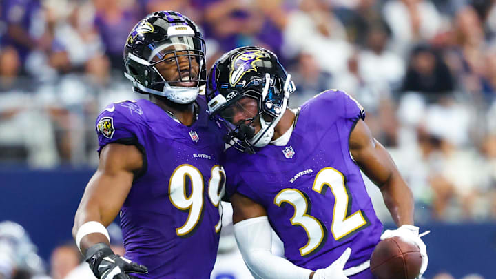Sep 22, 2024; Arlington, Texas, USA;  Baltimore Ravens safety Marcus Williams (32) celebrates with Baltimore Ravens linebacker Odafe Oweh (99) after recovering a fumble during the first half at AT&T Stadium. Mandatory Credit: Kevin Jairaj-Imagn Images