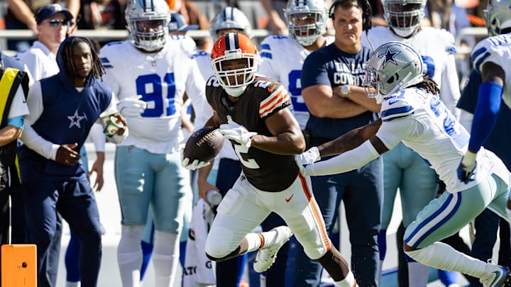 Sep 8, 2024; Cleveland, Ohio, USA; Cleveland Browns wide receiver Amari Cooper (2) runs the ball as Dallas Cowboys cornerback Caelen Carson (21) pushes him out of bounds during the first quarter at Huntington Bank Field. Mandatory Credit: Scott Galvin-Imagn Images