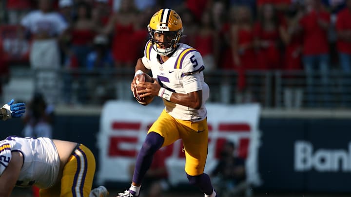 Sep 30, 2023; Oxford, Mississippi, USA; LSU Tigers quarterback Jayden Daniels (5) runs the ball 