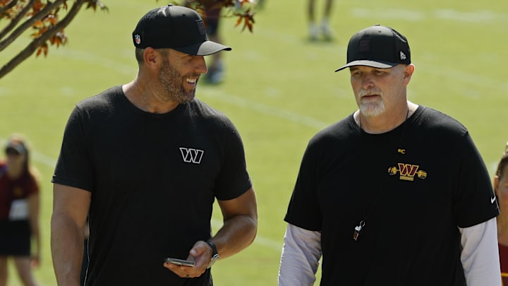 Jul 24, 2025; Ashburn, VA, USA; Washington Commanders general manager Adam Peters (L) talks with Commanders head coach Dan Quinn (R) while walking off the practice field on day two of training camp at OrthoVirginia Training Center at Commanders Park. Mandatory Credit: Geoff Burke-Imagn Images Jul 24, 2025; Ashburn, VA, USA; Washington Commanders general manager Adam Peters (L) talks with Commanders head coach Dan Quinn (R) while walking off the practice field on day two of training camp at OrthoVirginia Training Center at Commanders Park. Mandatory Credit: Geoff Burke-Imagn Images