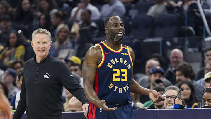 Jan 7, 2025; San Francisco, California, USA; Golden State Warriors forward Draymond Green (23) and head coach Steve Kerr react during the first quarter against the Miami Heat at Chase Center. Mandatory Credit: John Hefti-Imagn Images