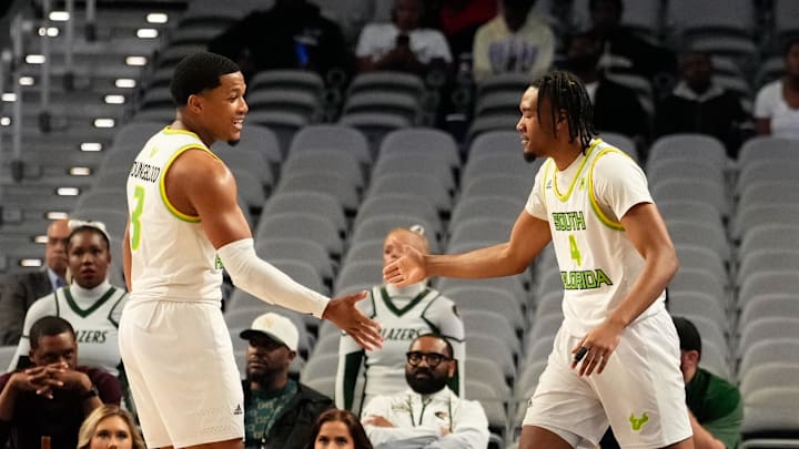 Mar 16, 2024; Fort Worth, TX, USA;  South Florida Bulls guard Kobe Knox (4) celebrates with South Florida Bulls guard Chris Youngblood (3) after scoring a three point basket against the UAB Blazers during the first half at Dickies Arena. Mandatory Credit: Chris Jones-USA TODAY Sports