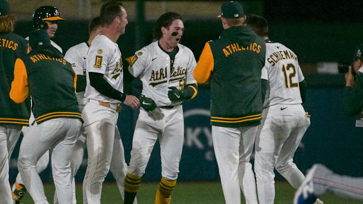Apr 24, 2025; West Sacramento, California, USA; Athletics shortstop Jacob Wilson (5) celebrates with team mates after hitting an rbi single against the Texas Rangers during the ninth inning at Sutter Health Park. Mandatory Credit: Ed Szczepanski-Imagn Images Apr 24, 2025; West Sacramento, California, USA; Athletics shortstop Jacob Wilson (5) celebrates with team mates after hitting an rbi single against the Texas Rangers during the ninth inning at Sutter Health Park. Mandatory Credit: Ed Szczepanski-Imagn Images