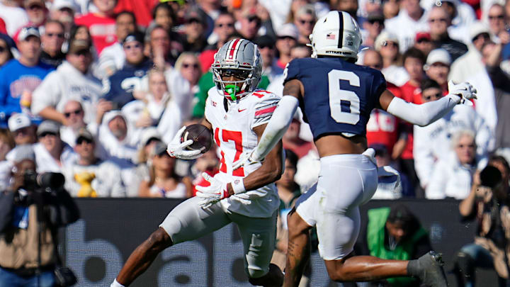 Ohio State Buckeyes wide receiver Carnell Tate (17) runs toward Penn State Nittany Lions safety Zakee Wheatley (6) during the NCAA football game at Beaver Stadium in University Park, Pa. on Monday, Nov. 4, 2024. Ohio State won 20-13.