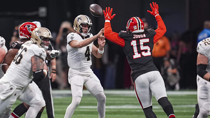 Sep 29, 2024; Atlanta, Georgia, USA; Atlanta Falcons linebacker Matthew Judon (15) deflects a pass by Atlanta Falcons quarterback Kirk Cousins (18) that is intercepted and returned for a touchdown during the first half at Mercedes-Benz Stadium. Mandatory Credit: Dale Zanine-Imagn Images Sep 29, 2024; Atlanta, Georgia, USA; Atlanta Falcons linebacker Matthew Judon (15) deflects a pass by Atlanta Falcons quarterback Kirk Cousins (18) that is intercepted and returned for a touchdown during the first half at Mercedes-Benz Stadium. Mandatory Credit: Dale Zanine-Imagn Images