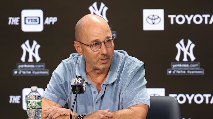 Aug 23, 2023; Bronx, New York, USA; New York Yankees general manager Brian Cashman talks with the media before the game between the Yankees and the Washington Nationals at Yankee Stadium. Mandatory Credit: Vincent Carchietta-Imagn Images