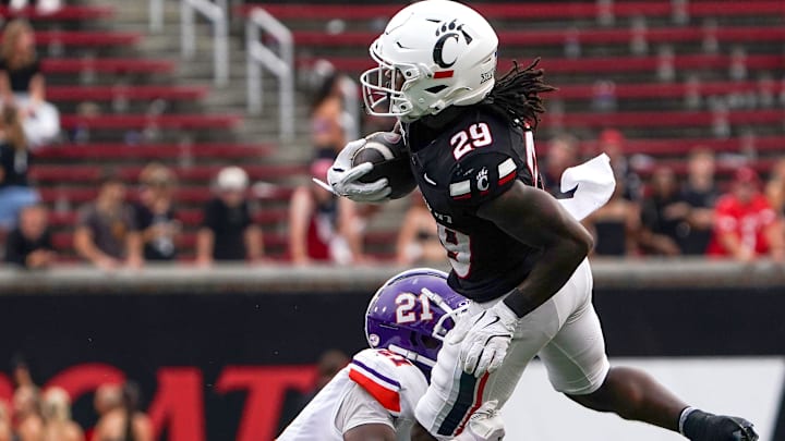 Northwestern State Demons cornerback Ja'Marion Bonner (21) tackles Cincinnati Bearcats running back Manny Covey in the fourth quarter of a NCAA men’s college football game between the Cincinnati Bearcats and Northwestern State Demons, Saturday, Sept. 13, 2025, at Nippert Stadium in Cincinnati. Bearcats won 70-0. Northwestern State Demons cornerback Ja'Marion Bonner (21) tackles Cincinnati Bearcats running back Manny Covey in the fourth quarter of a NCAA men’s college football game between the Cincinnati Bearcats and Northwestern State Demons, Saturday, Sept. 13, 2025, at Nippert Stadium in Cincinnati. Bearcats won 70-0.