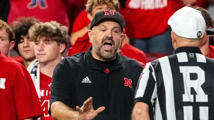 Sep 20, 2024; Lincoln, Nebraska, USA; Nebraska Cornhuskers head coach Matt Rhule talks with officials after an interception during the second quarter against the Illinois Fighting Illini at Memorial Stadium. Mandatory Credit: Dylan Widger-Imagn Images